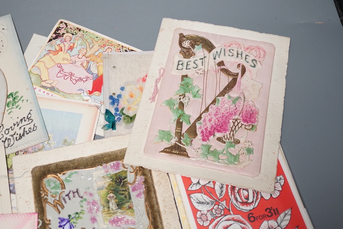 A collection of postcards and greetings cards